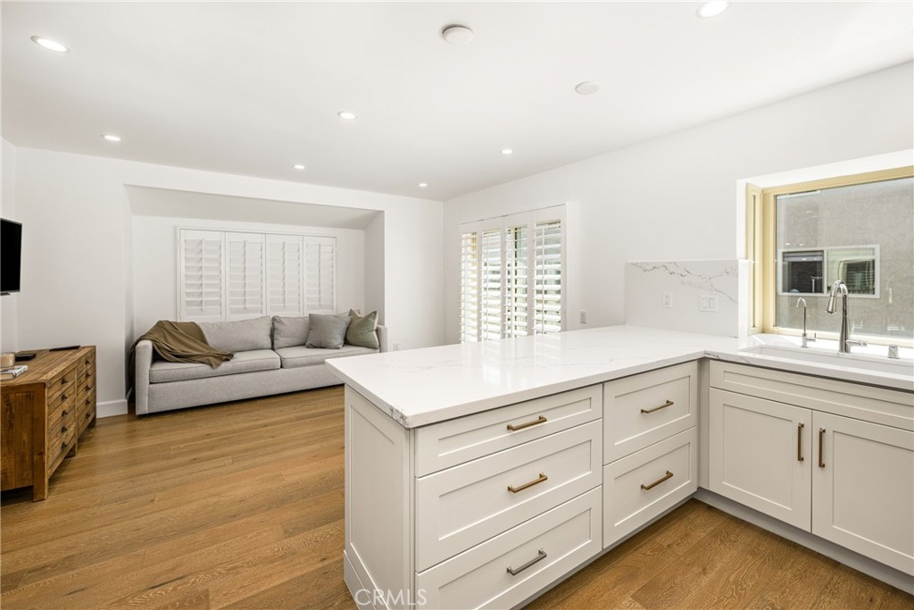 8 Moon Shadow, Unit 8 Irvine, CA 92603 - Photo 21 of 42 a living room with furniture and windows