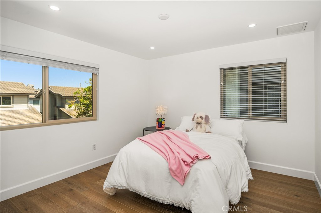 8 Moon Shadow, Unit 8 Irvine, CA 92603 - Photo 24 of 42 a bedroom with a bed and a window