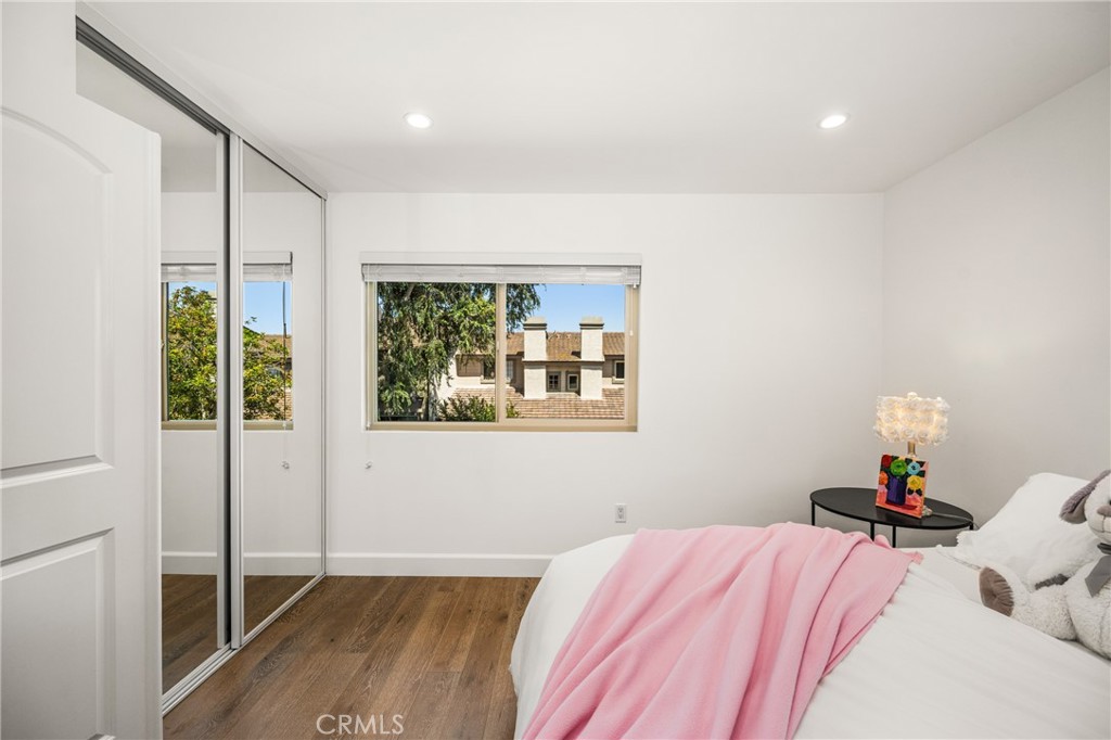 8 Moon Shadow, Unit 8 Irvine, CA 92603 - Photo 25 of 42 a bedroom with a bed and a window