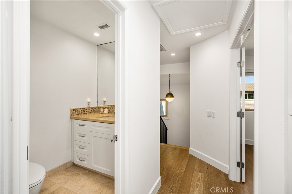 8 Moon Shadow, Unit 8 Irvine, CA 92603 - Photo 27 of 42 a view of walk in closet with wooden floor