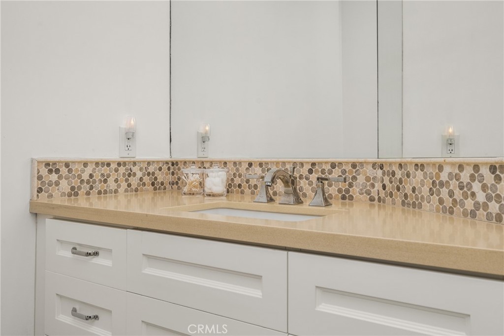 8 Moon Shadow, Unit 8 Irvine, CA 92603 - Photo 29 of 42 a bathroom with a sink and vanity
