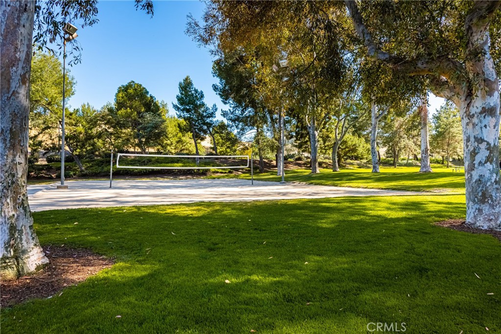 8 Moon Shadow, Unit 8 Irvine, CA 92603 - Photo 39 of 42 a view of a swimming pool with an outdoor space and seating area
