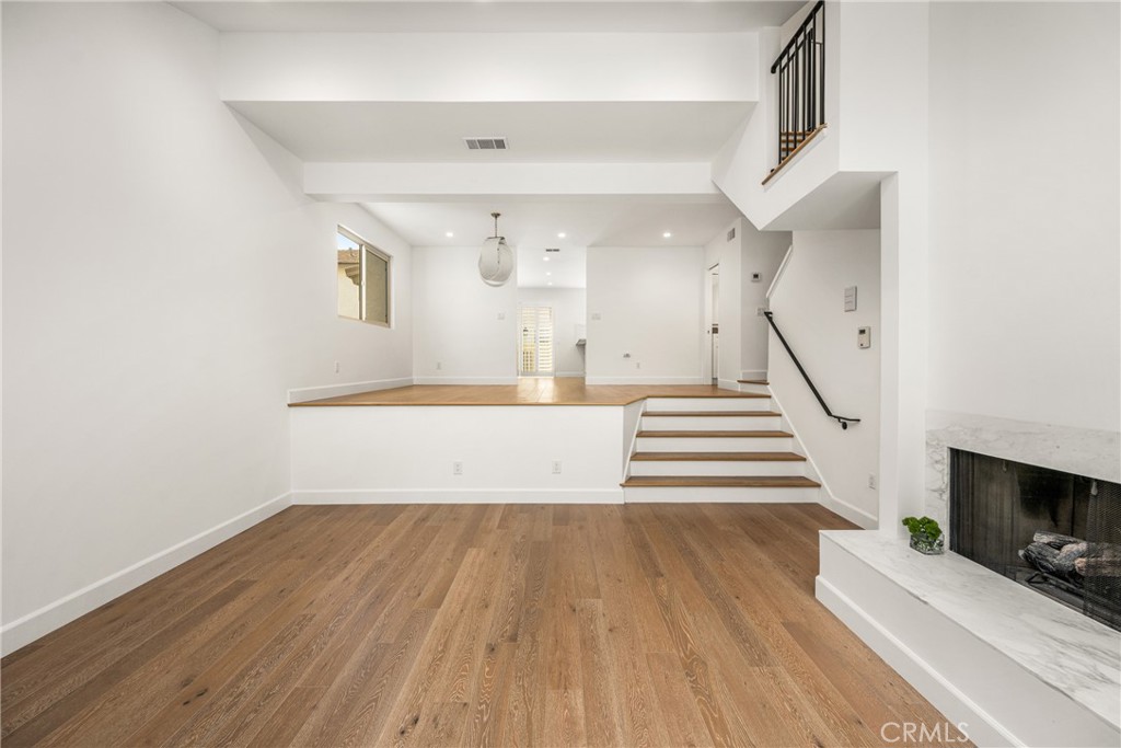 8 Moon Shadow, Unit 8 Irvine, CA 92603 - Photo 7 of 42 a view of entryway and hall with wooden floor