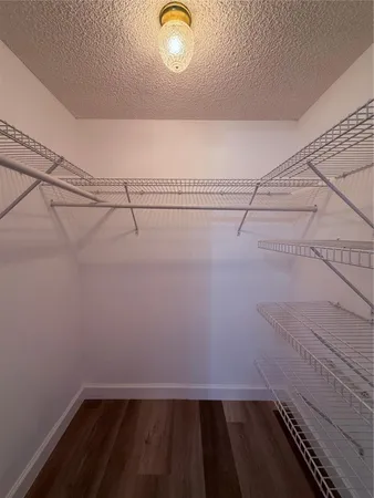 a bathroom with a double vanity sink toilet and shower