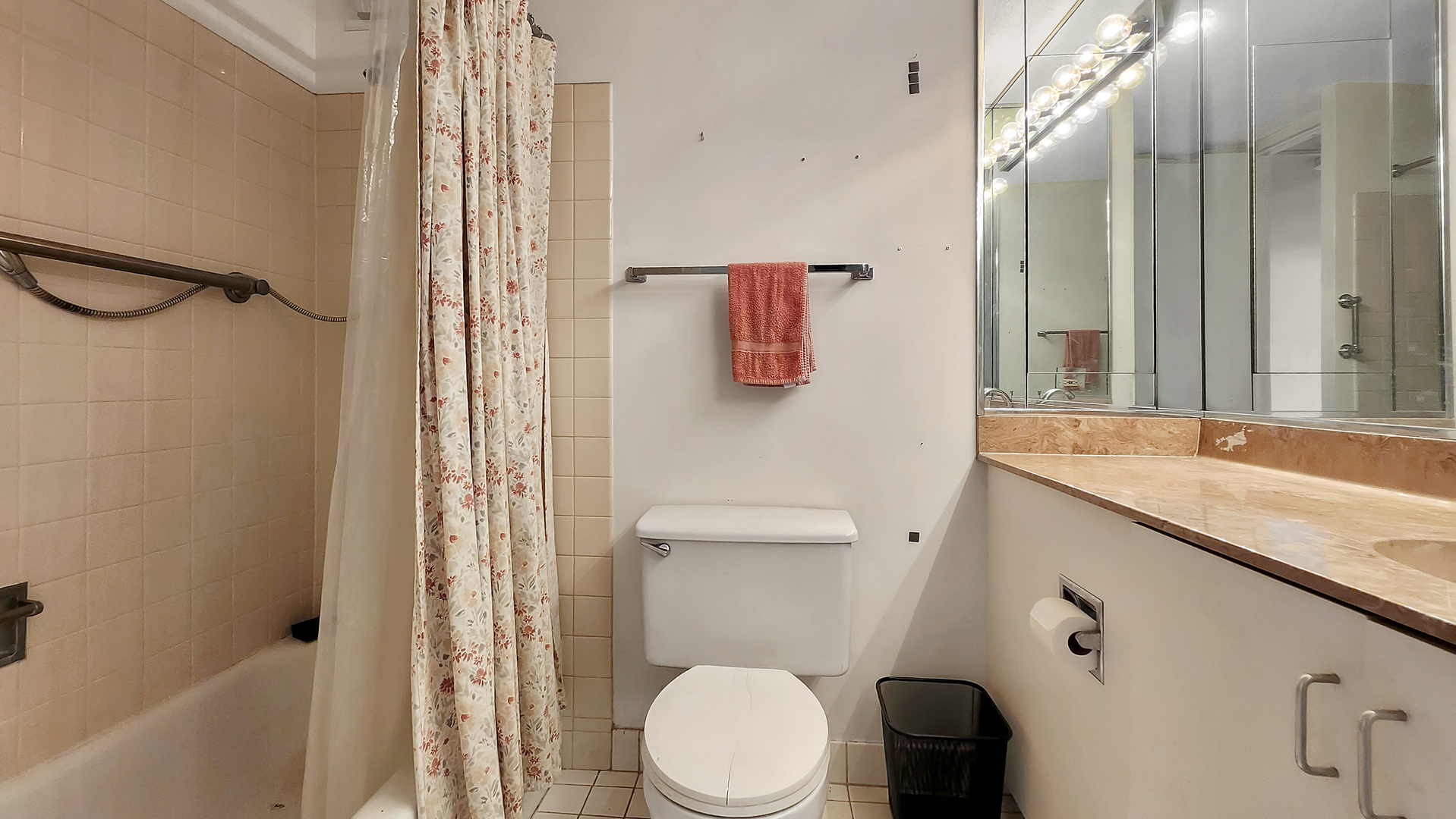 405 North Wabash Avenue, Unit 314 Chicago, IL 60611 - Photo 12 of 26 a bathroom with a granite countertop sink toilet and shower