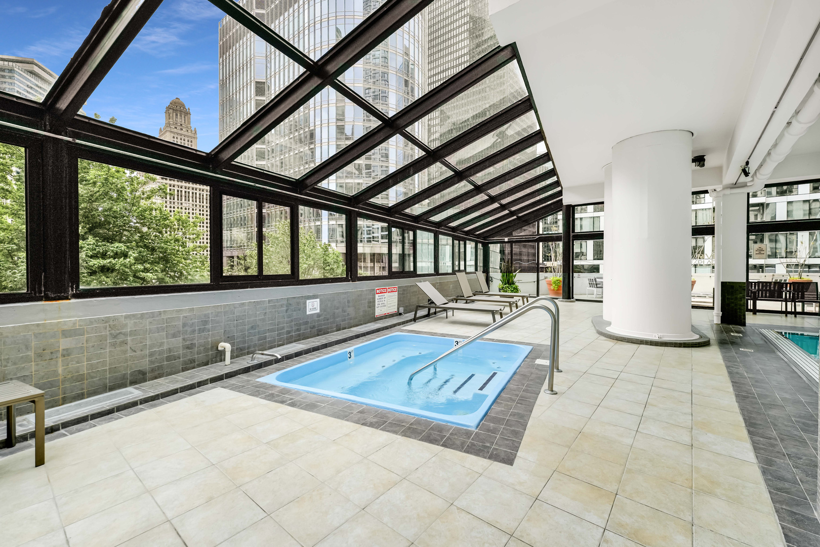 405 North Wabash Avenue, Unit 314 Chicago, IL 60611 - Photo 25 of 26 a living room with a large bed