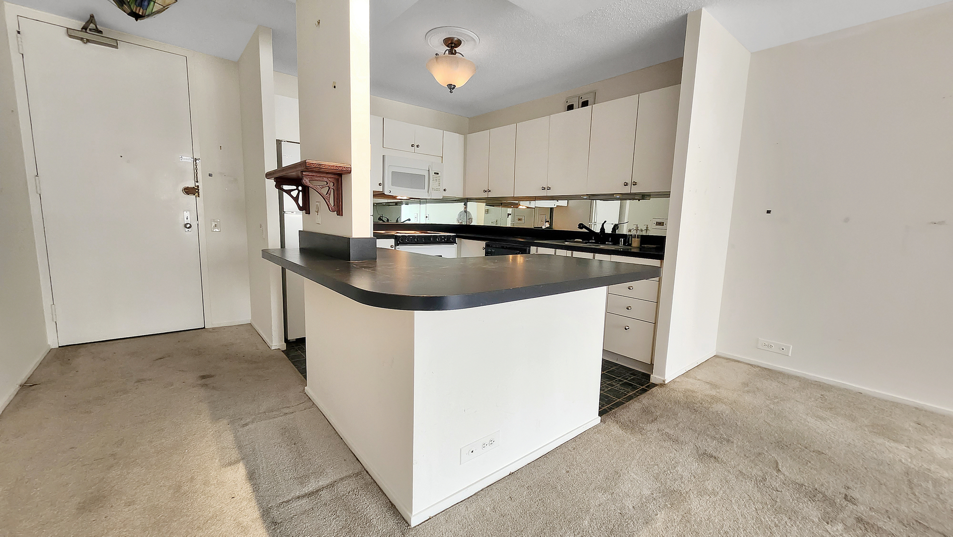 405 North Wabash Avenue, Unit 314 Chicago, IL 60611 - Photo 4 of 26 a kitchen with stainless steel appliances granite countertop a refrigerator a sink and a stove