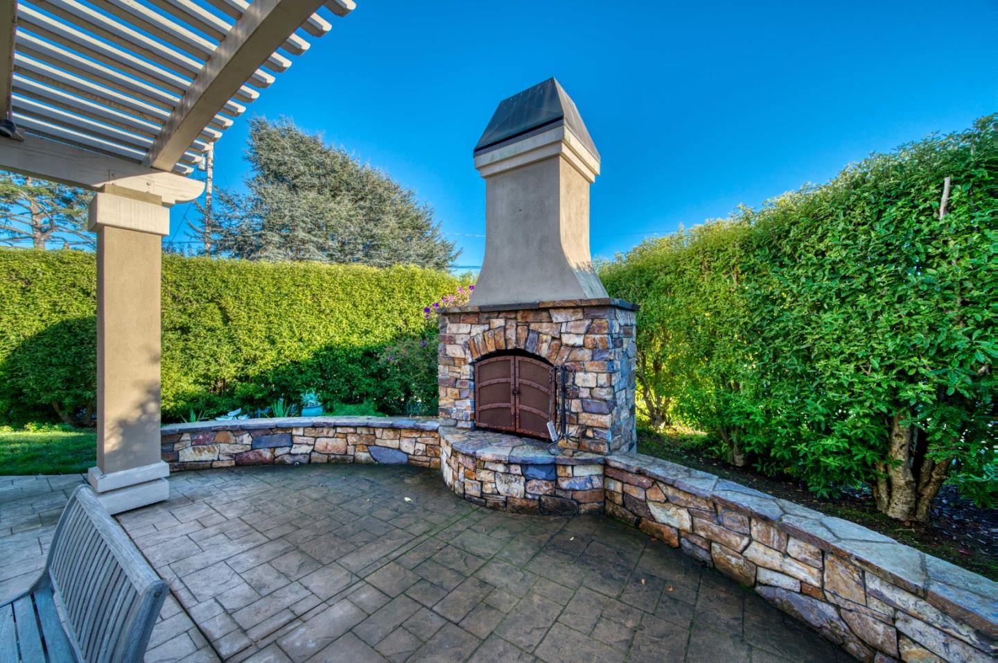 400 Seaview Drive Aptos, CA 95003 - Photo 19 of 58 a view of a chair and table in backyard of the house