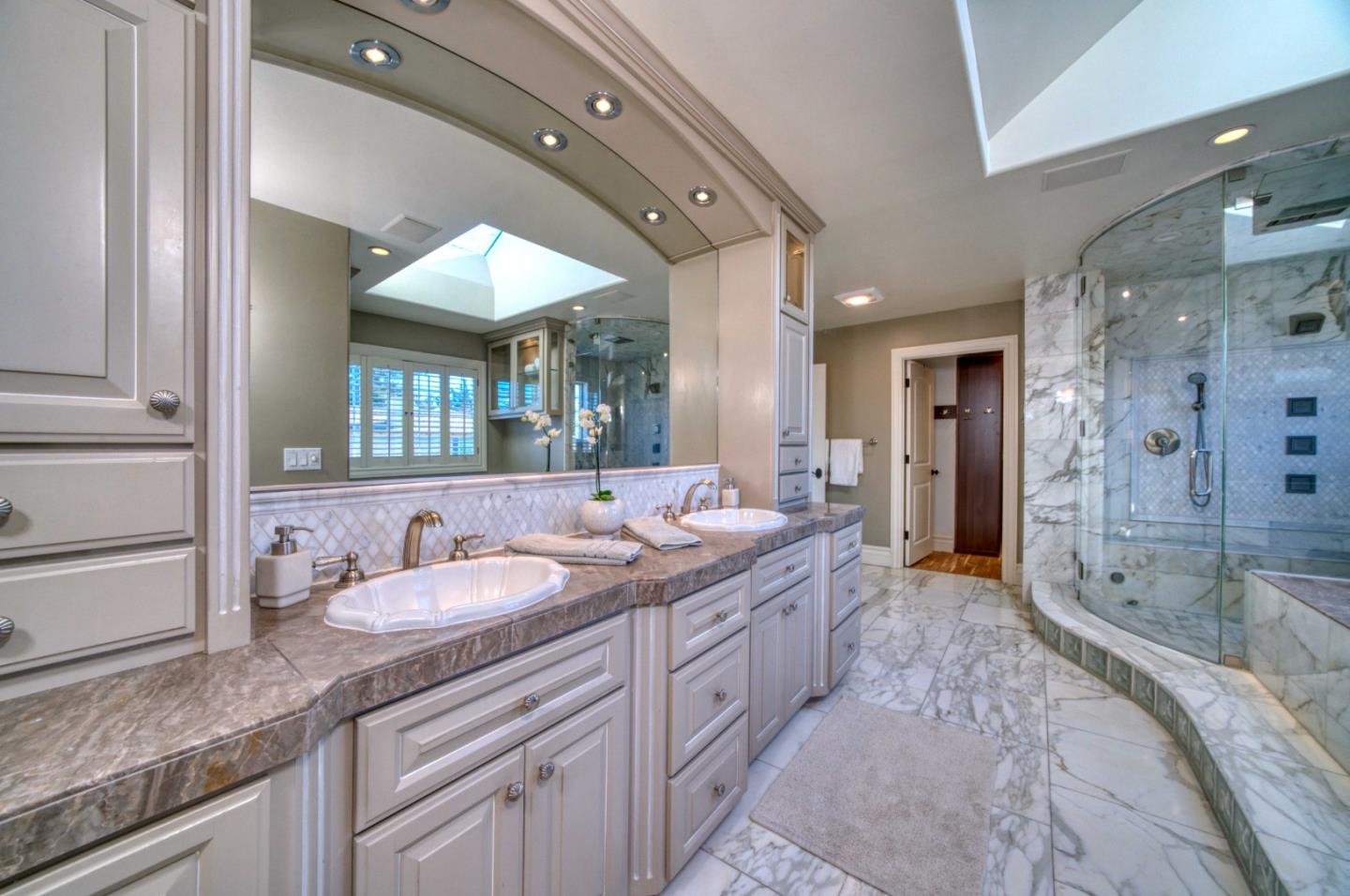 400 Seaview Drive Aptos, CA 95003 - Photo 35 of 58 a spacious bathroom with a granite countertop sink mirror and shower