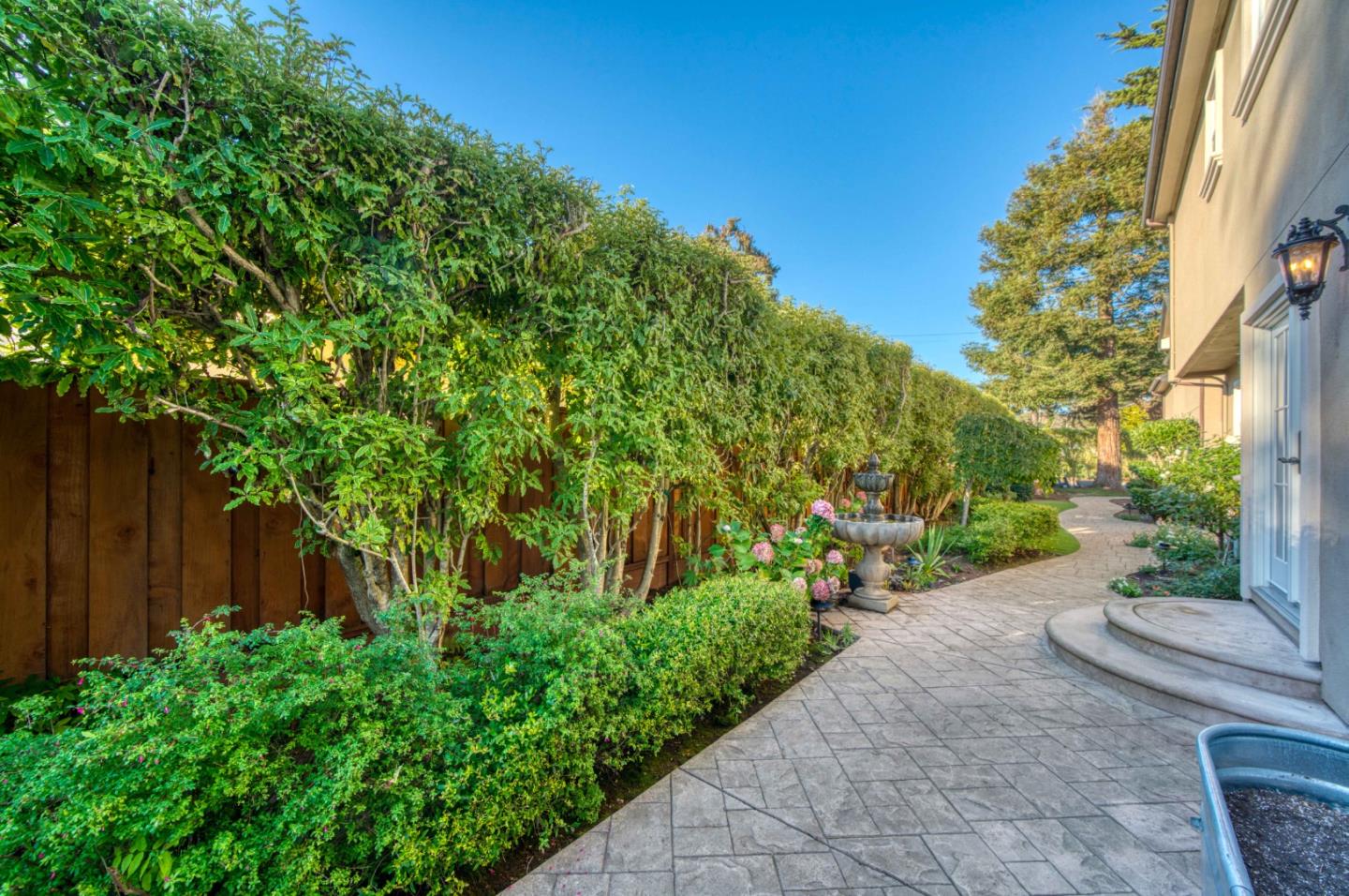 400 Seaview Drive Aptos, CA 95003 - Photo 52 of 58 a view of a backyard with potted plants and large tree