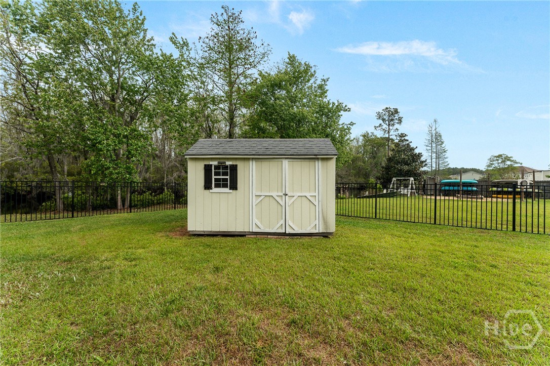 108 Saratoga Drive Rincon, GA 31326 - Photo 58 of 63 Storage Building in backyard