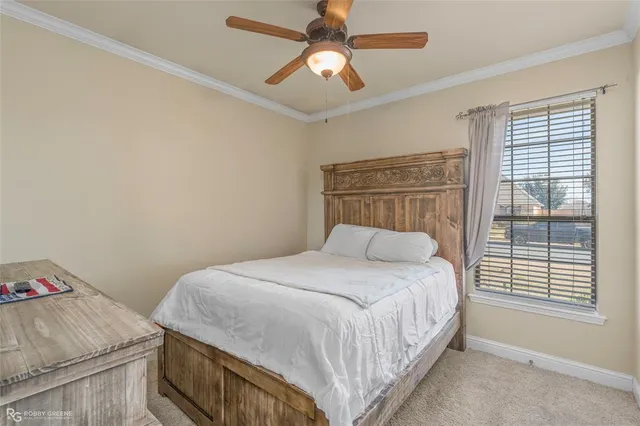 a bathroom with a sink vanity mirror and toilet