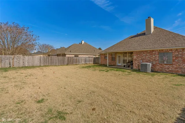 a house with swimming pool in front of it