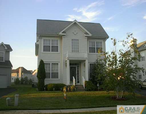 49 Timber Ridge Road North Brunswick, NJ 08902 - Photo 1 of 8 a front view of a house with a yard