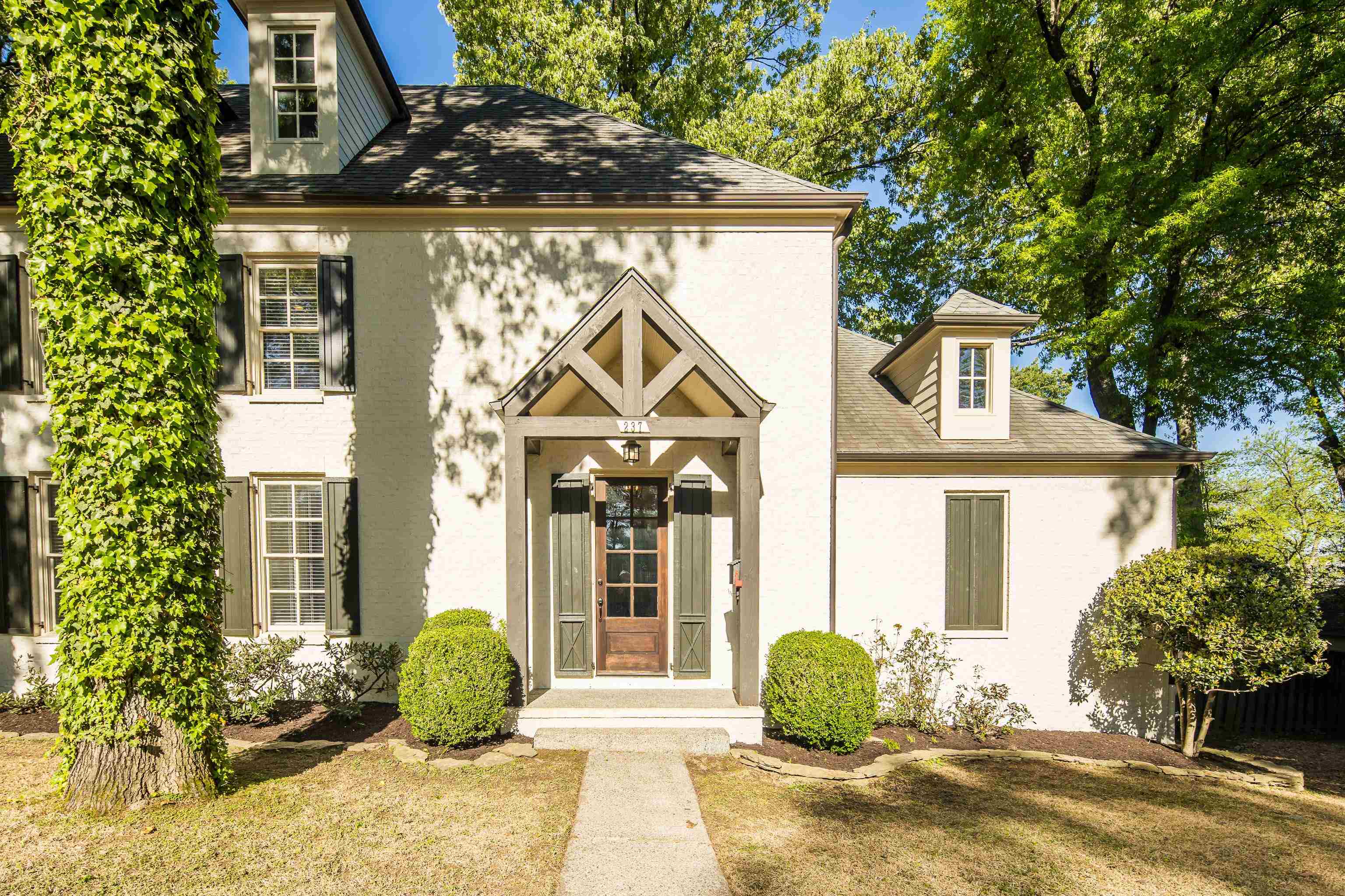 237 Windover Road Memphis, TN 38111 - Photo 7 of 37 View of front of house featuring a front lawn, a shingled roof, and stucco siding