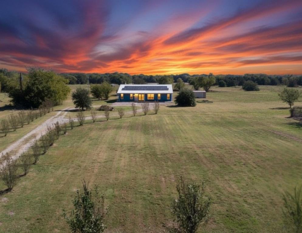 a view of a street with a building in the background