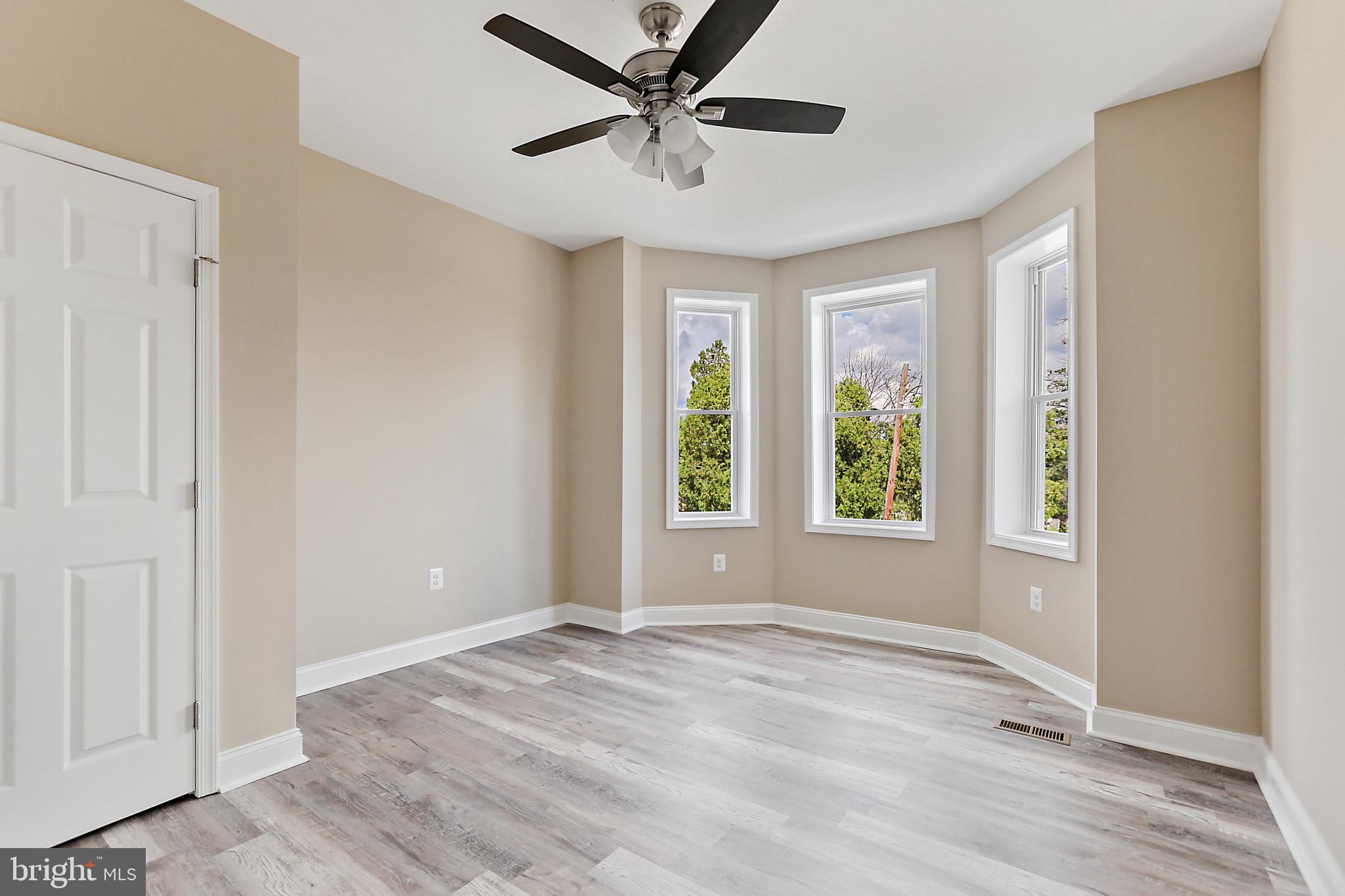 100 Collins Avenue Baltimore, MD 21229 - Photo 14 of 18 a view of an empty room with a window