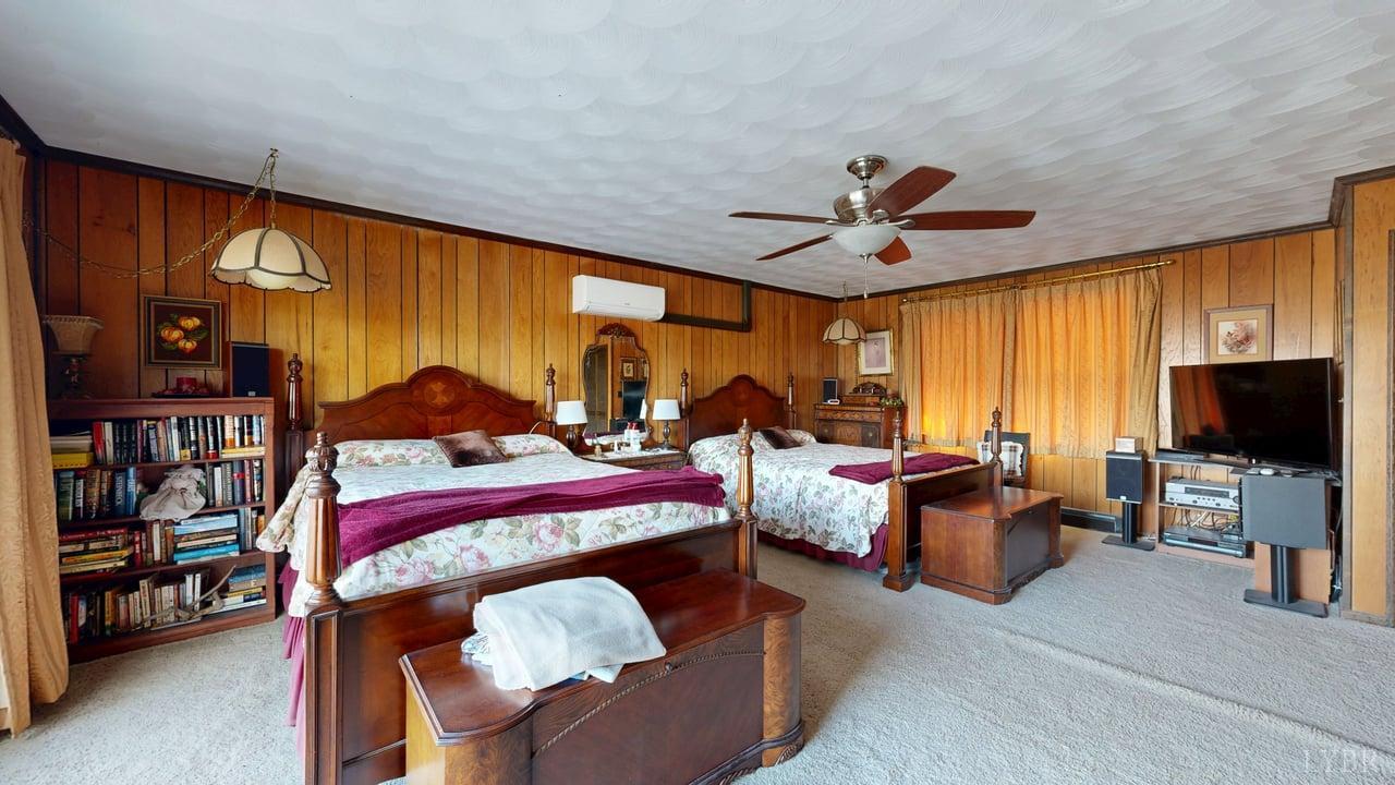 426 Burgess Road Madison Heights, VA 24572 - Photo 21 of 51 a bedroom with furniture and a flat screen tv