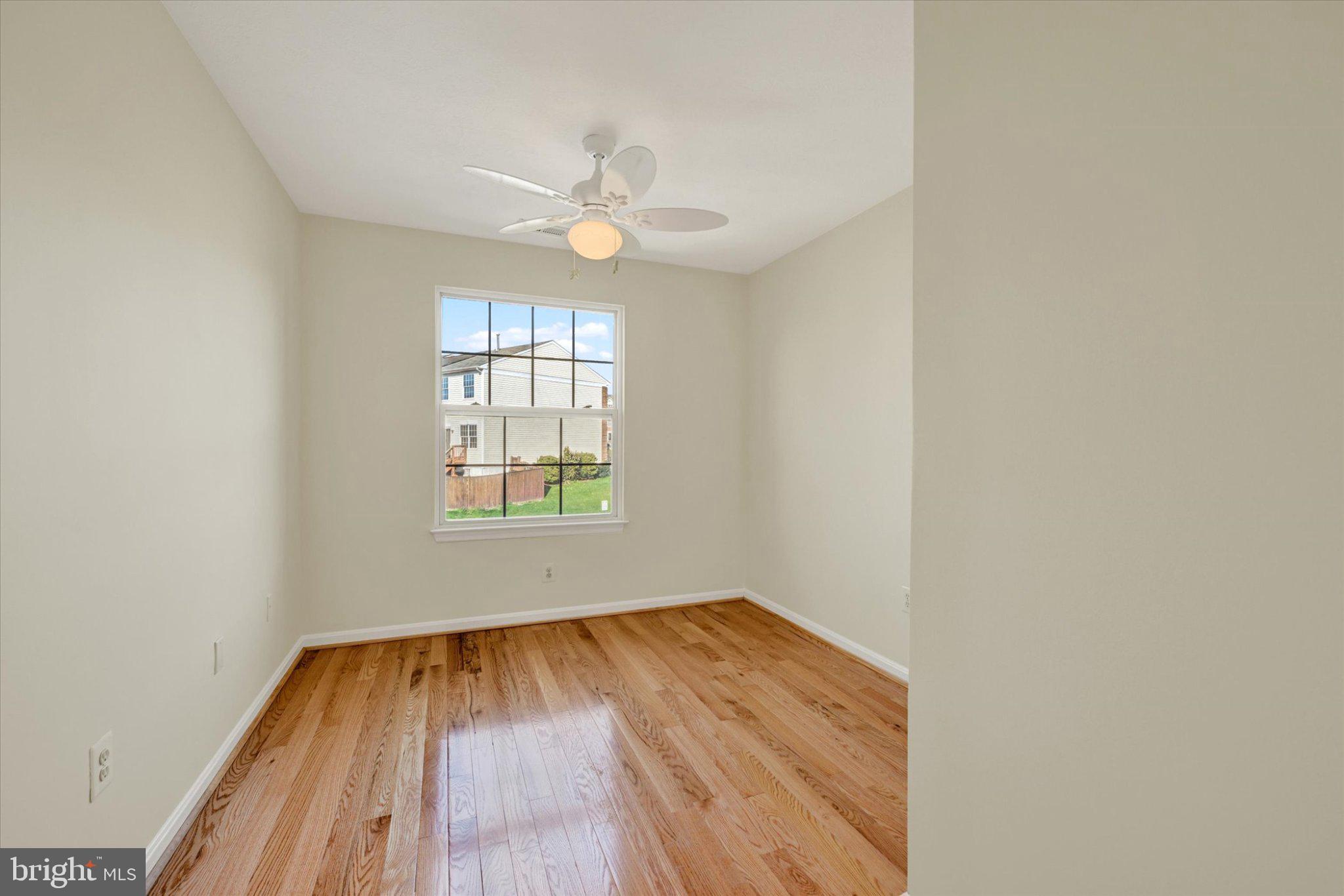 7120 Natures Road Columbia, MD 21046 - Photo 12 of 20 Bright and airy 3rd bedroom with hardwood floors.