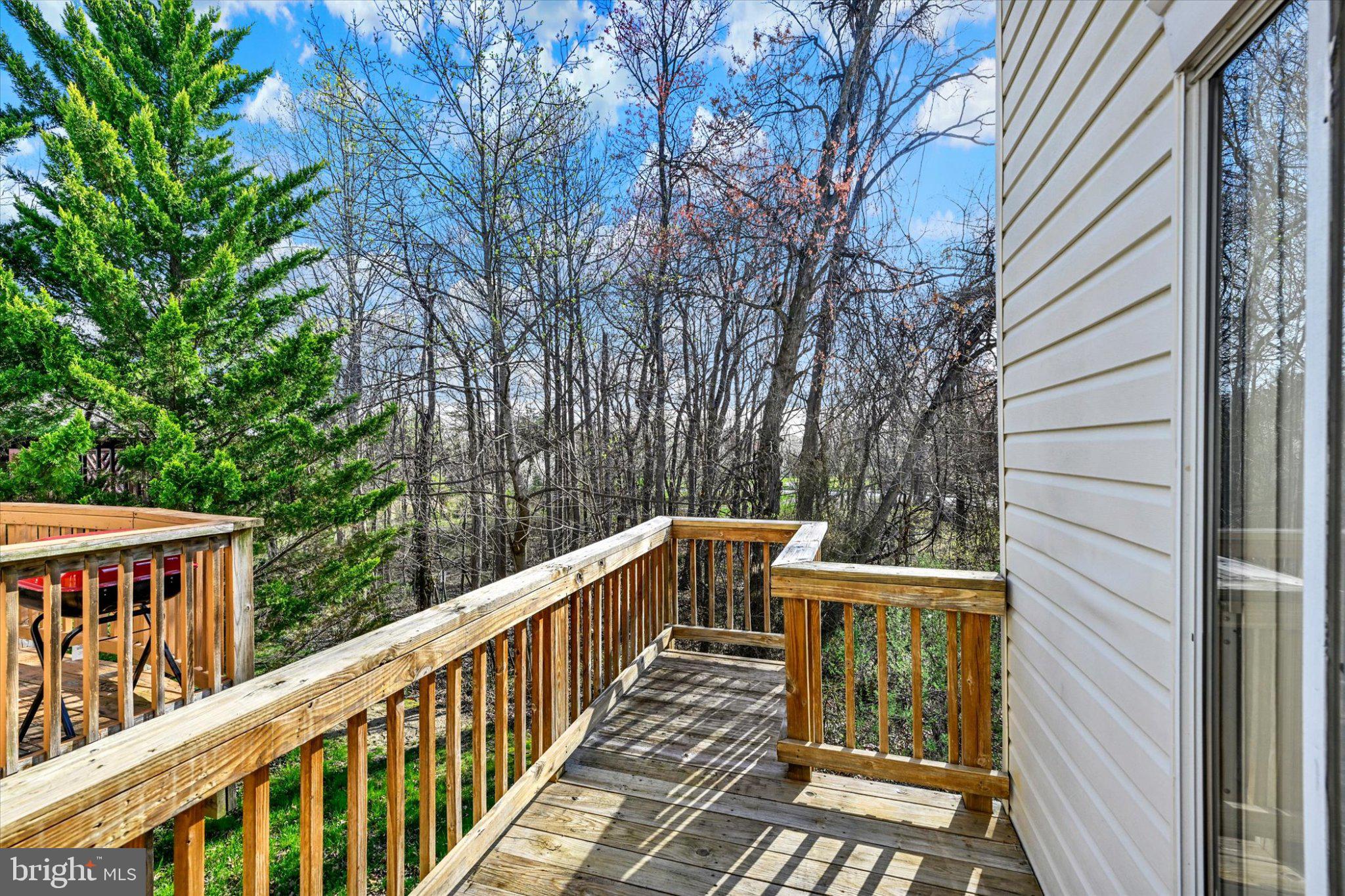7120 Natures Road Columbia, MD 21046 - Photo 3 of 20 Serene deck overlooking lush greenery.