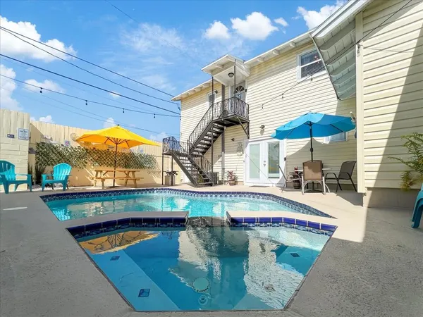 a view of a swimming pool with a patio
