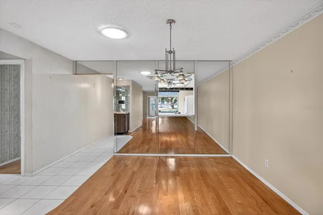 a kitchen with stainless steel appliances a stove a refrigerator and a microwave