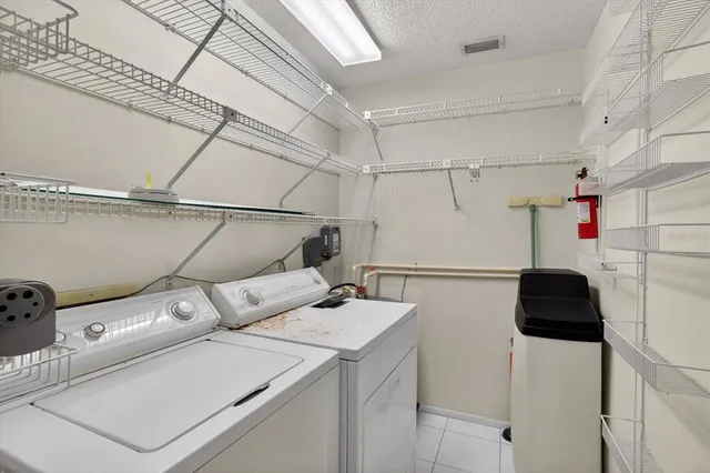 a front view of a house with a garden and patio