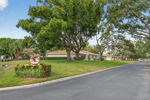 an aerial view of residential houses with city and lake view