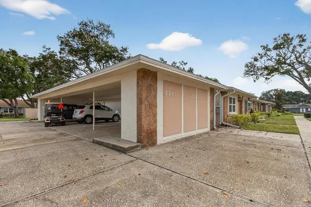 an aerial view of a houses with yard