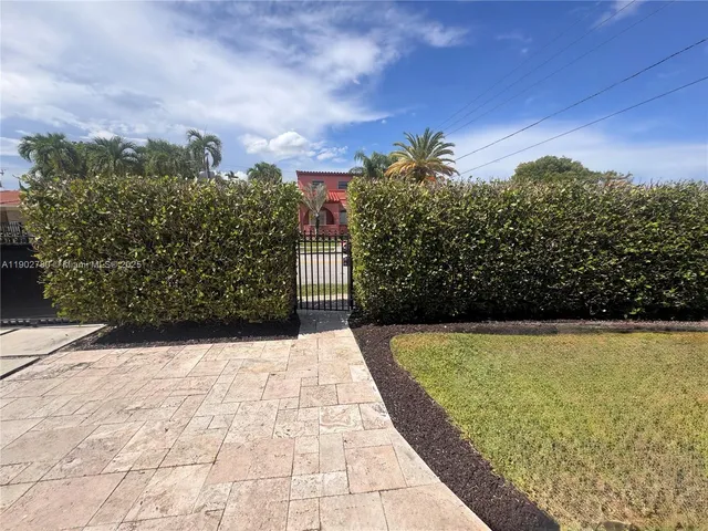 a view of a car parked in a yard