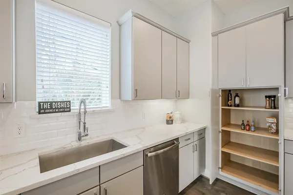 a kitchen with a sink and cabinets