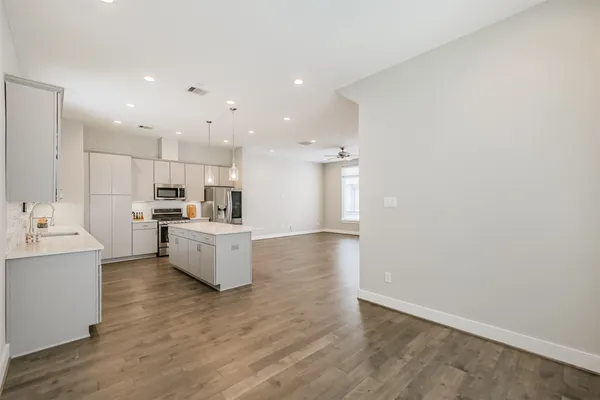 a large kitchen with a lot of counter top space