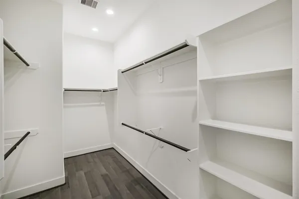 an empty room with wooden floor