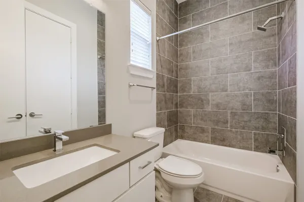 a bathroom with a sink a toilet and a bathtub