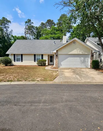 front view of a house with a yard