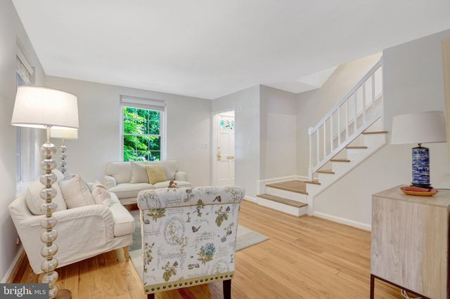 a kitchen with a table and chairs in it