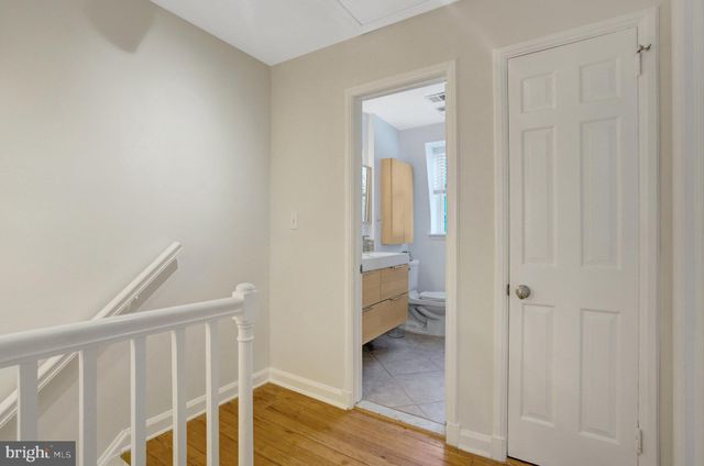 a bedroom with a bed and a desk