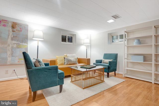 a bathroom with a sink a mirror a vanity and a shower