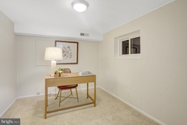 a bathroom with a shower sink and mirror