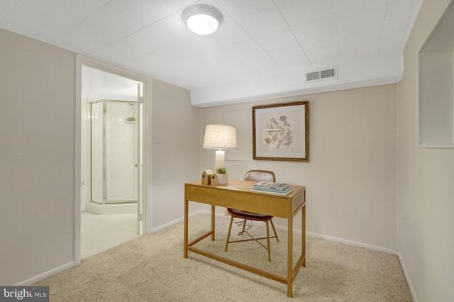 a bathroom with a shower sink and mirror
