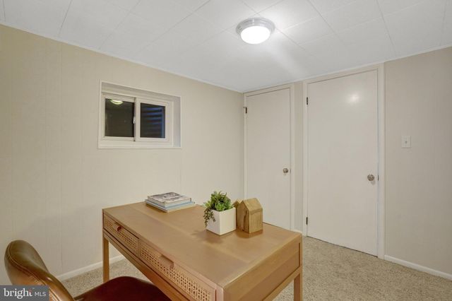 a close view of a utility room with dryer and washer