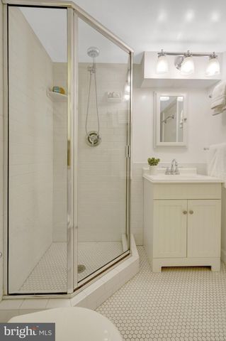 a patio with a table and chairs under an umbrella