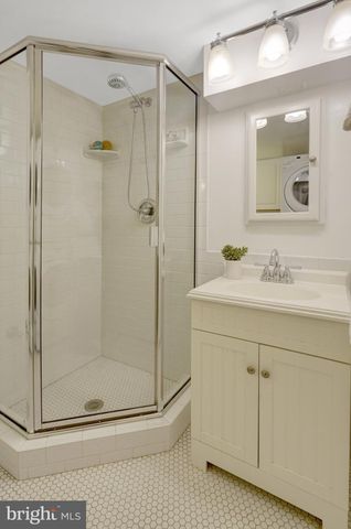 a view of a swimming pool with sitting area and furniture