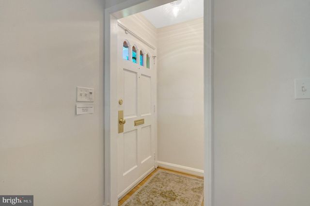 a front view of a house with parking area