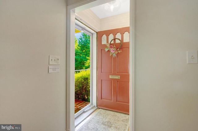 a living room with furniture and a lamp