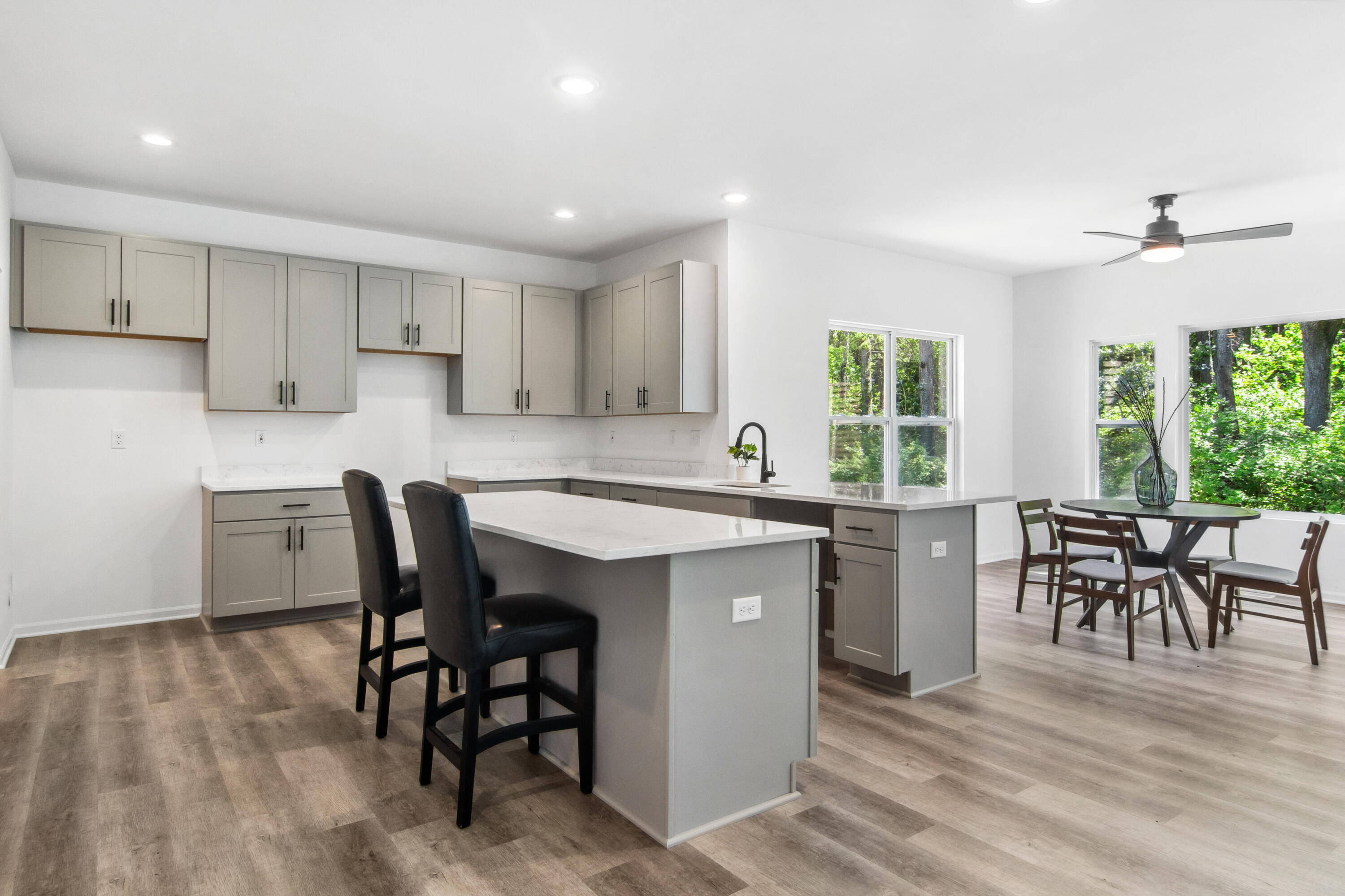 10360 California Street Crown Point, IN 46307 - Photo 11 of 22 a kitchen with a table chairs sink and cabinets