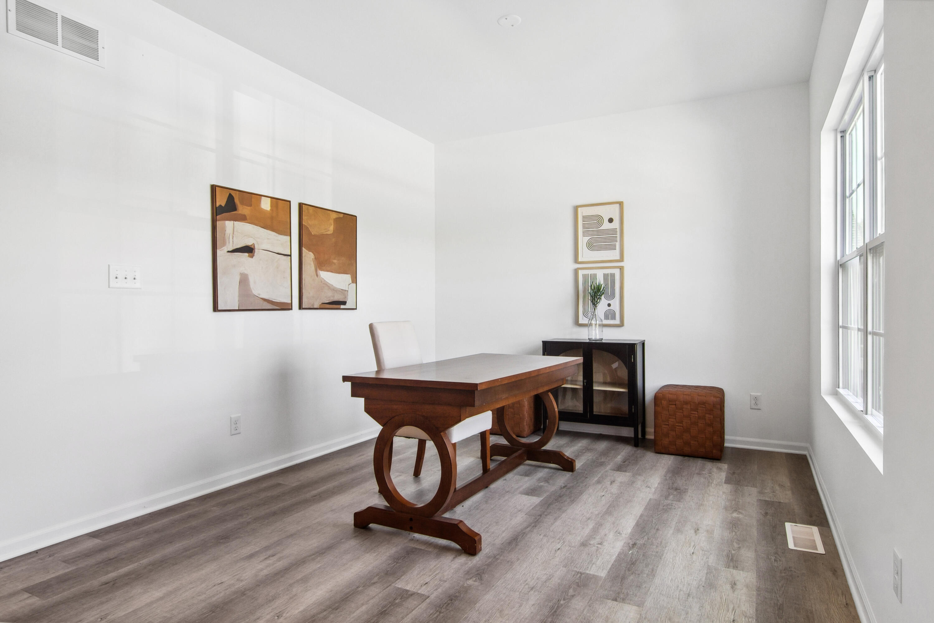 10360 California Street Crown Point, IN 46307 - Photo 3 of 22 a workspace with furniture and a window