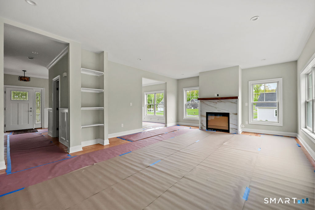 8 Ridgewood Club Road Prospect, CT 06712 - Photo 9 of 40 a view of empty room with a fireplace and window