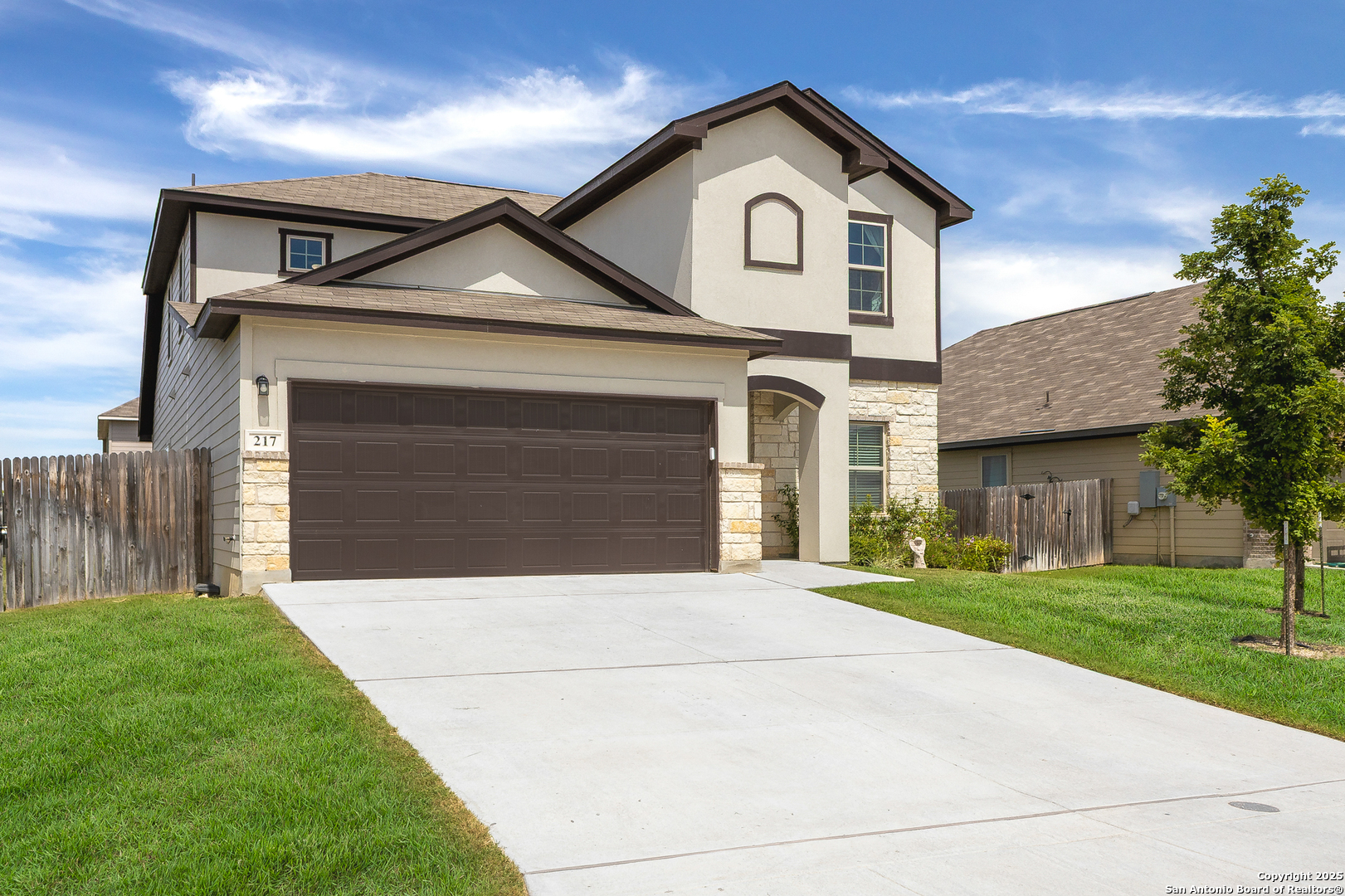 217 Stag Way Cibolo, TX 78108 - Photo 3 of 31 a front view of a house with a yard and garage