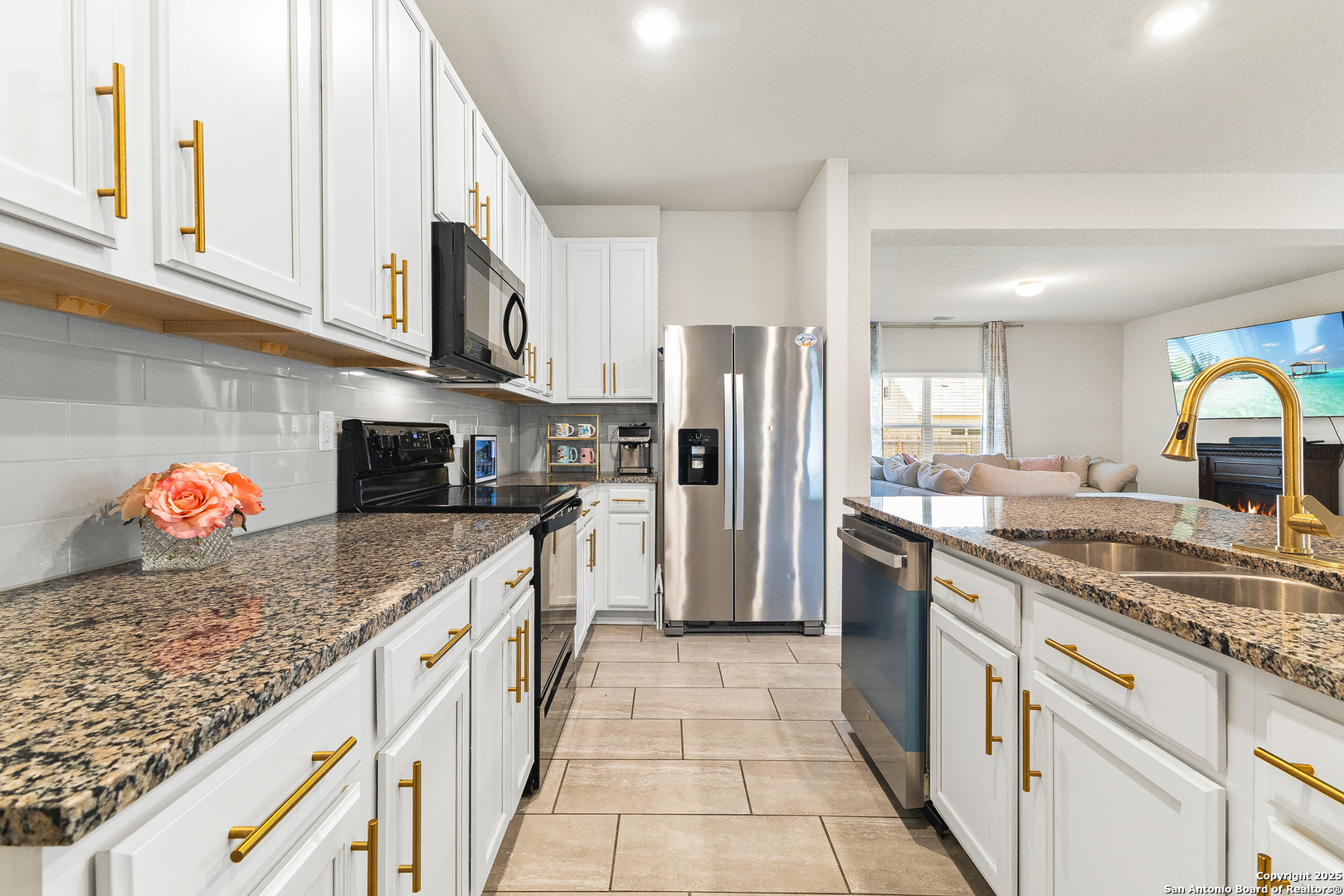 217 Stag Way Cibolo, TX 78108 - Photo 8 of 31 a kitchen with stainless steel appliances granite countertop a sink stove and refrigerator